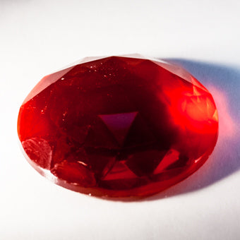 40X30MM OVAL FACETED RED